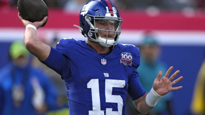 Tommy-DeVito-throws-a-pass-in-the-1st-half